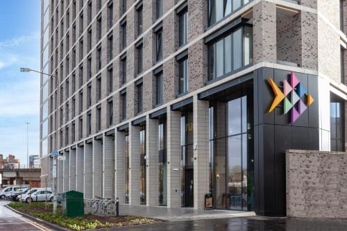 a building with a x sign on the side of it at For Students Only Stylish Studios in Glasgow in Glasgow