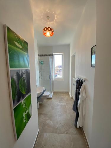 a bathroom with a sink and a toilet at Stadtgarten in Meißen