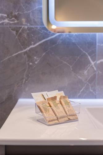 three books are sitting on a table in a room at Affittacamere Sulle Stelle in La Spezia
