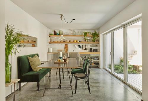 a kitchen and dining room with a table and chairs at Casa Blanca Łagów in Łagów