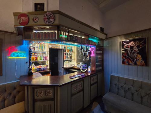 a bar in a pub with a bar counter at The Rockley Hotel in Blackpool