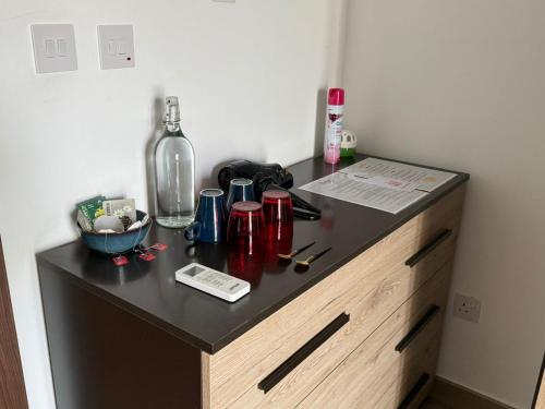 a black counter with a bottle on top of it at Airport Accommodation Bedroom with Bathroom, balcony, aircondition, self checkIn, 24 hours check-in after 3pm in Mqabba