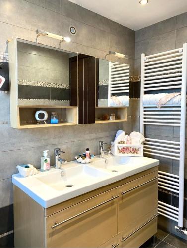 a bathroom with a sink and a mirror at Diamond Rod Villa near Faliraki in Kalithies
