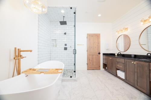 a white bathroom with a tub and a sink at Milly 8752 in Brighton