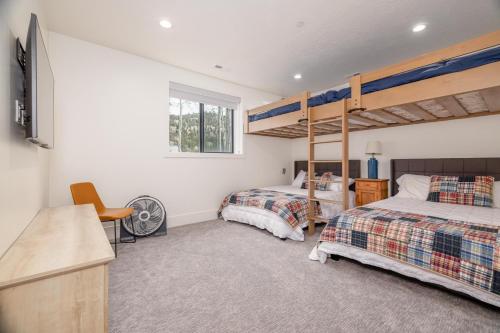 a bedroom with two beds and a bunk bed at Milly 8752 in Brighton