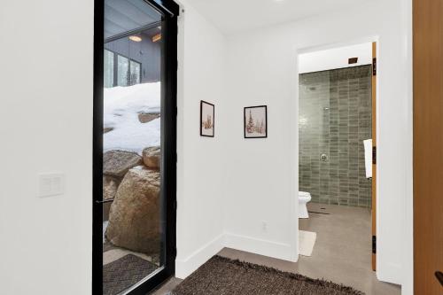 a mirror in a room with a bathroom at Milly Slopeside Studio in Brighton