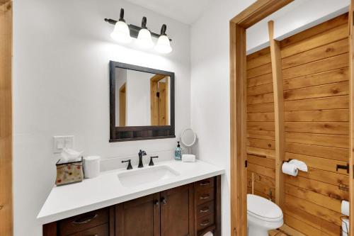 a bathroom with a sink and a toilet at Chalet at Brighton in Brighton