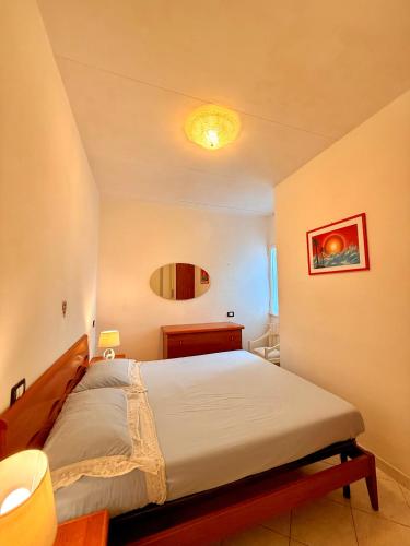 a bedroom with a large bed in a room at Villa Chiara in Follonica