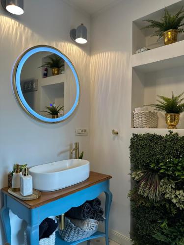 a bathroom with a sink and a mirror on the wall at Cabana A-frame D&J in Mada