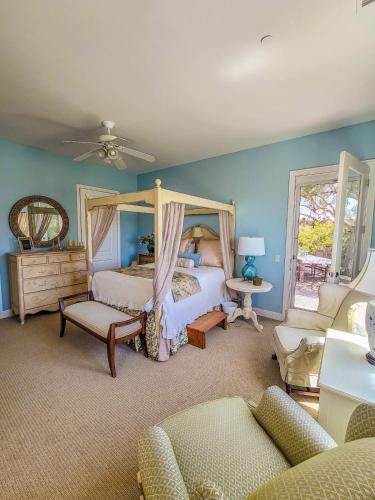 a bedroom with two beds and a canopy bed at Beverlys Hilltop Retreat in Fallbrook