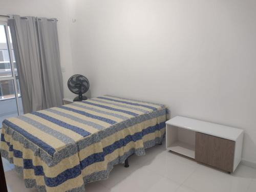 a hospital room with a bed and a table at AZURE residence in Caucaia