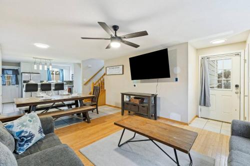 a living room with a couch and a flat screen tv at Pet Friendly near Garden of the Gods AF Academy in Colorado Springs