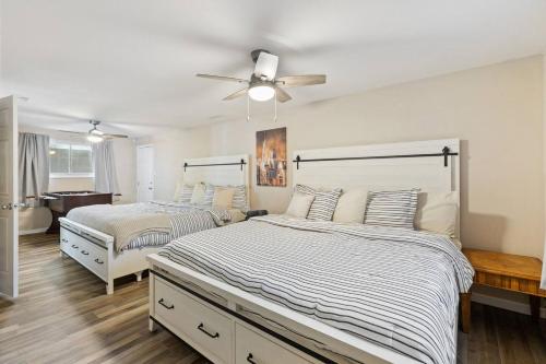 a bedroom with two beds and a ceiling fan at Pet Friendly near Garden of the Gods AF Academy in Colorado Springs