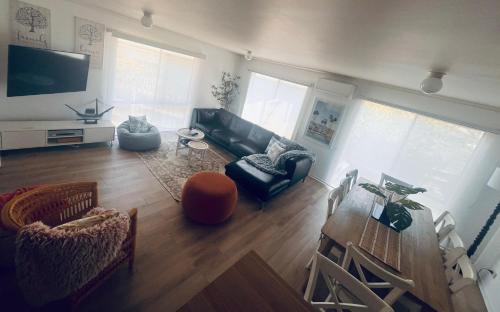 a living room with a couch and a table at THE PHILLY in Cowes