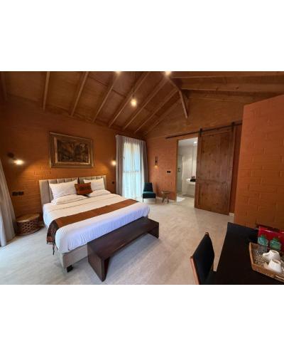 a bedroom with a large bed in a room at Aerys Village in Somone