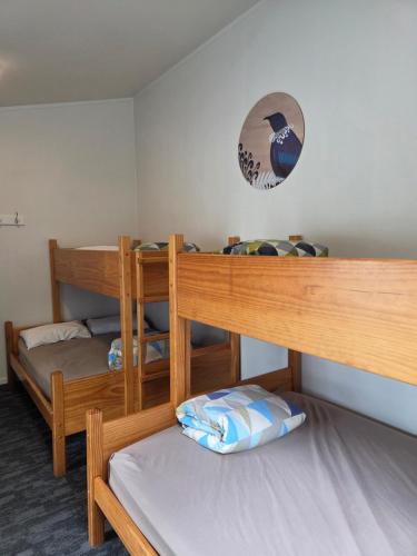 a room with two bunk beds in it at Tasman Holiday Parks - Coromandel in Coromandel Town