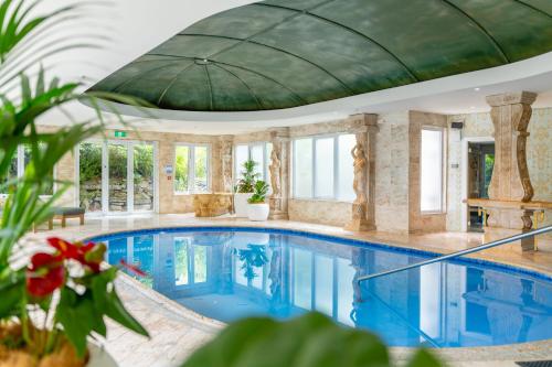 a large swimming pool with a domed ceiling at Coronet Ridge Resort in Queenstown