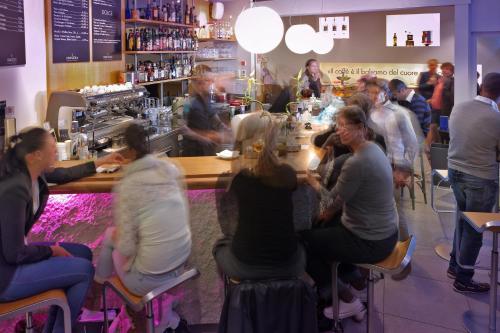 a group of people sitting at a bar at Hotel St.Gotthard in Zürich