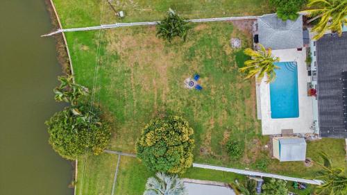 an aerial view of a yard with a swimming pool at Lakehouse Sunsets in Sebastian