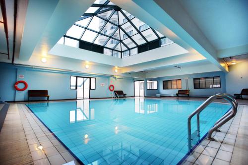 a large swimming pool with a skylight at Copthorne Cameron Highlands in Cameron Highlands