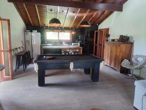 a living room with a pool table in it at Sítio ou chácara in Gravataí