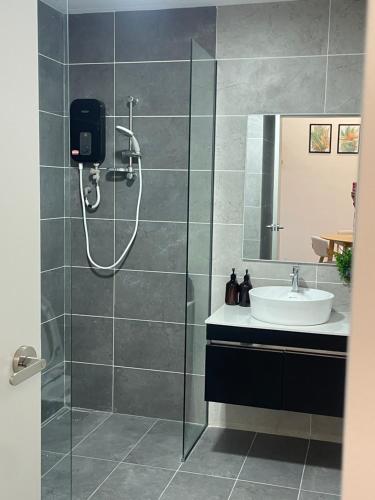 a bathroom with a shower and a sink at ResidenShals in Putrajaya