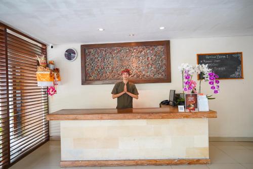 a statue of a man standing at a counter at Pertiwi Bisma 1 in Ubud