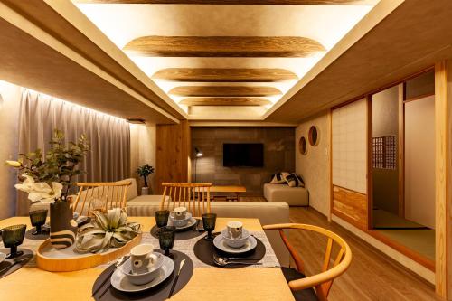 a dining room with a table and chairs at PREMIER suite Shinjuku West 3F 4F in Tokyo