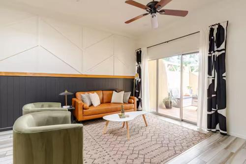 a living room with a couch and a table at Central Phoenix Townhome in Phoenix