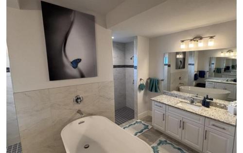 a bathroom with a toilet and a sink and a shower at Sandi Villa in Cape Coral