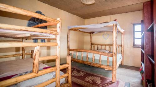 Ένα ή περισσότερα κρεβάτια σε δωμάτιο στο WE4Kenya Guesthouses