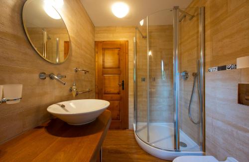 a bathroom with a sink and a shower at Platanus by Hotel Pieris in Pribylina