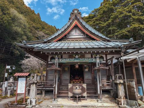 a temple on the side of a mountain at 宿坊 窪之坊 Temple Lodging in Minobu