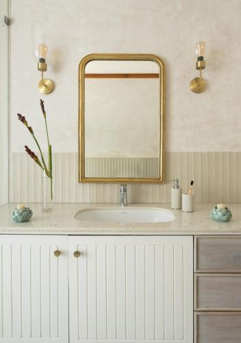 a bathroom with a sink and a mirror at LohonoStays Villa Floresta in Assagao