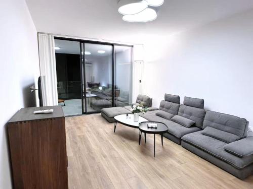 a living room with a couch and a table at Luna Mare in Limassol