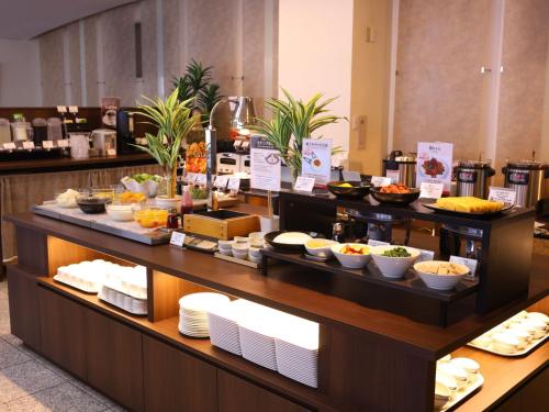 a buffet of food on display in a hotel room at APA Hotel Ogaki Ekimae in Ogaki