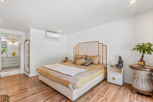 a bedroom with a large bed in a room at Redwoods Luxury Sanctuary in Redway