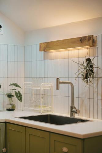 a kitchen with a sink in a kitchen with at Bow Hanok House in Gangneung