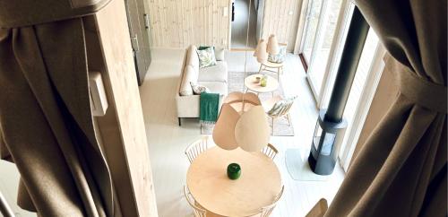 an overhead view of a living room with a table and chairs at Lilla Brattön in Myggenäs