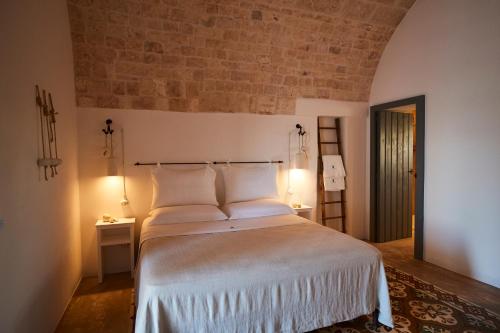 Postel nebo postele na pokoji v ubytování Masseria Almadava