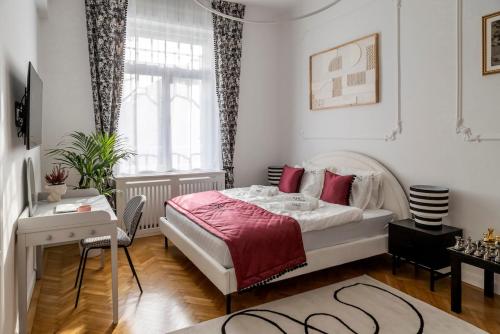 a bedroom with a large bed and a window at NEBarrabona in Győr