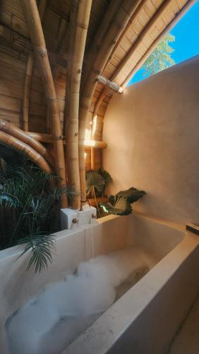a bath tub with smoke coming out of it at Sea Turtle Villas in Gili Islands