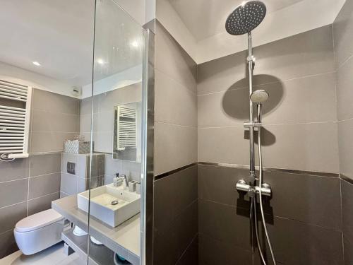 a bathroom with a shower and a sink at T2 à 200m des plages in Propriano