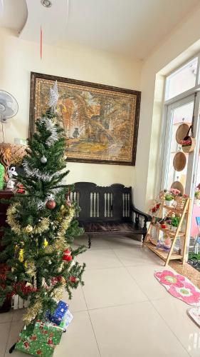 a christmas tree in the middle of a living room at Lucky Minh An in Nha Trang
