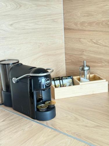 a coffee maker on the floor in a room at Haga Home in Tallinn