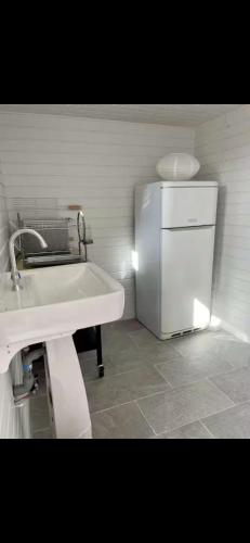 a kitchen with a white refrigerator and a sink at Marée Ault - Maison de ville échappée mer in Ault