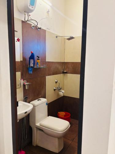 a bathroom with a toilet and a sink at Love shore in Cochin