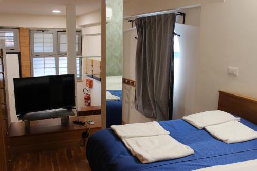 En eller flere senge i et værelse på Loft Roma Tre