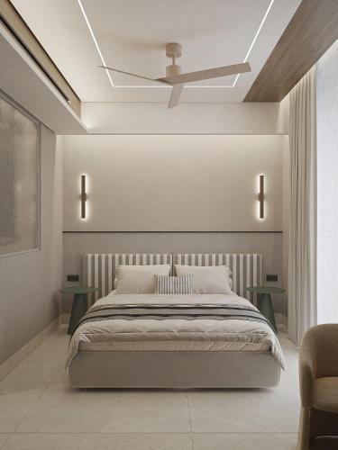 ein Schlafzimmer mit Bett und Deckenventilator in der Unterkunft Okeanis Elysium in Daratso