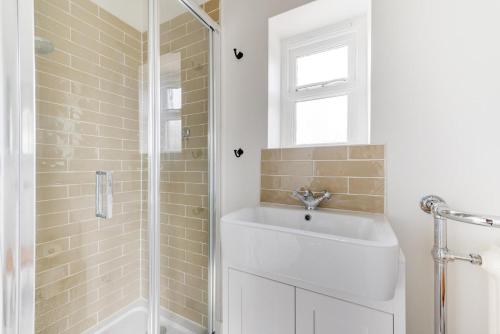 a bathroom with a sink and a shower at 5 Bed in Walberswick oc-tww in Walberswick
